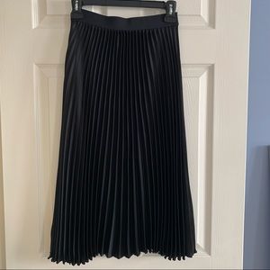 Brand new midi length pleated satin skirt